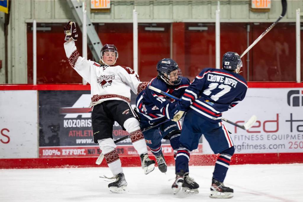 An Osoyoos Coyote lost his feet while fighting for the puck, the Sicamous Eagles lost the game 6-2 on Friday night, Oct. 10. (TEN Pandas Photography-Facebook)